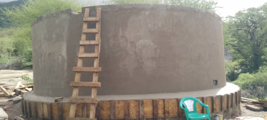 Circular community water tank taking shape during construction in Longido, Tanzania