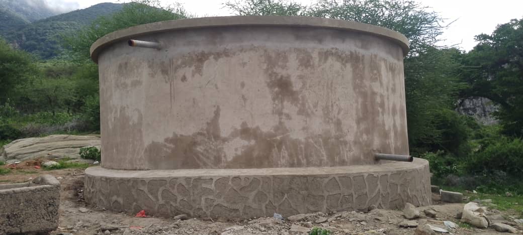 Completed concrete community water tank before final painting in Longido, Tanzania