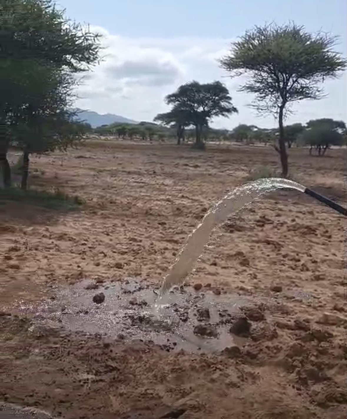 Fresh water flowing from a newly drilled well in Longido, Tanzania